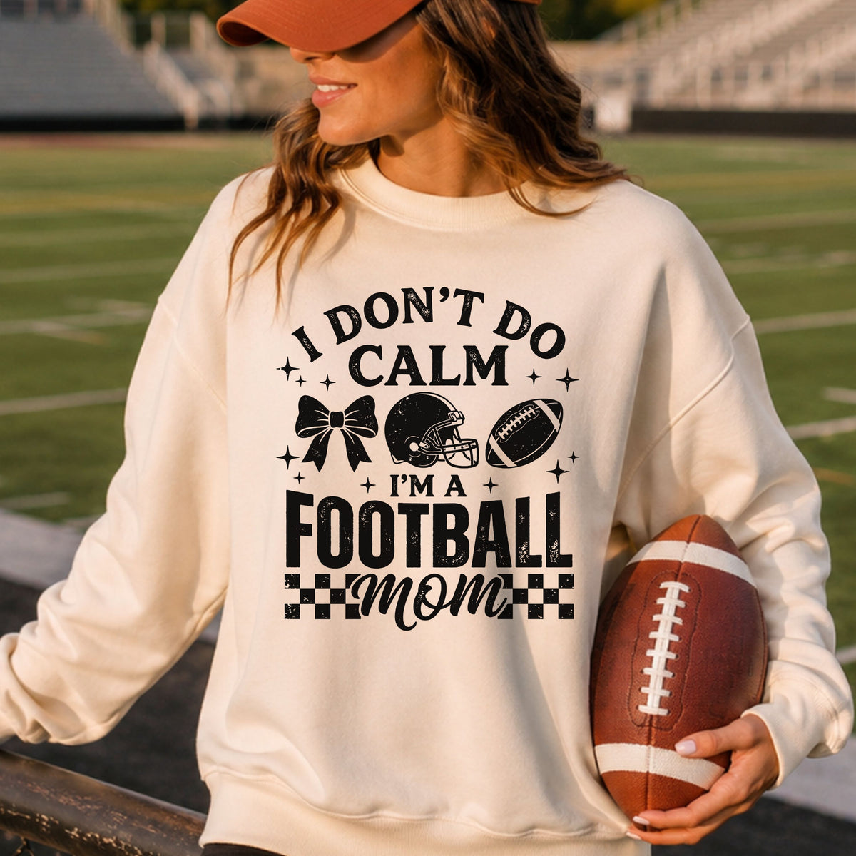 I Don’t Do Calm I’m a Football Mom DTF transfer featuring distressed black lettering, football helmet, football, bow, sparkle accents, and checkered game day details.