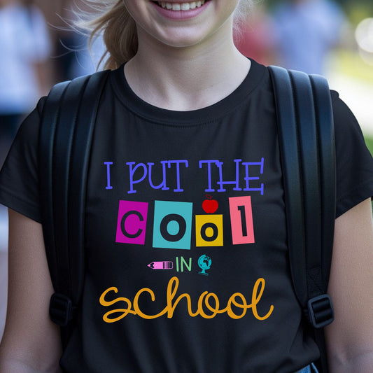 I Put the Cool in School back-to-school design with colorful playful lettering, an apple, pencil, and globe accents for toddler, kids, and youth shirts.