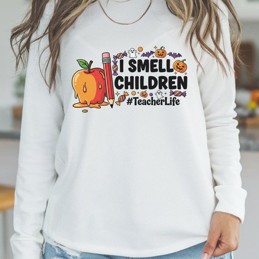 Funny I Smell Children Halloween teacher design featuring a melting apple, red pencil, pumpkins, bats, ghosts, candy, and bold Teacher Life lettering.