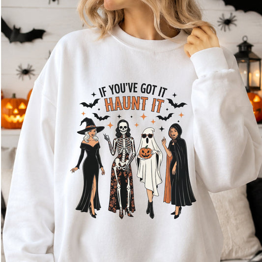 If You’ve Got It Haunt It Halloween DTF transfer featuring a witch, skeleton, sheet ghost and spooky woman in black with bats, stars and orange Halloween accents