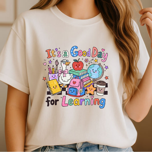 It’s a Good Day for Learning DTF transfer featuring cute school supplies, books, apple, globe, backpack, pencils, coffee cup, and colorful classroom characters.