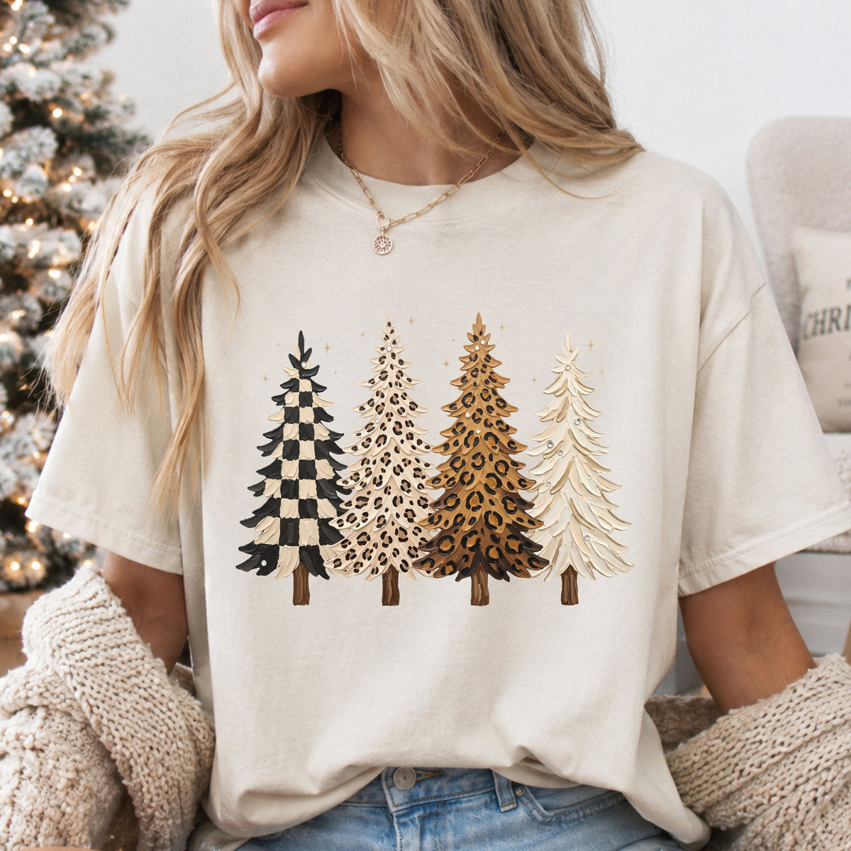 Four Christmas trees with a thick paint effect: black and cream checks, cream leopard print, tan leopard print and solid cream, with faux rhinestone accents.