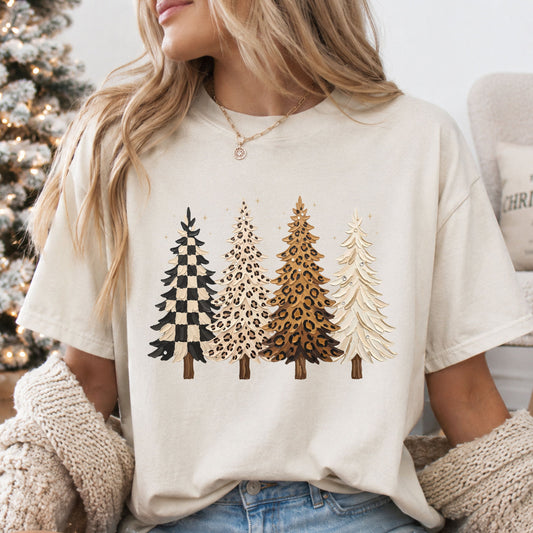 Four Christmas trees with a thick paint effect: black and cream checks, cream leopard print, tan leopard print and solid cream, with faux rhinestone accents.