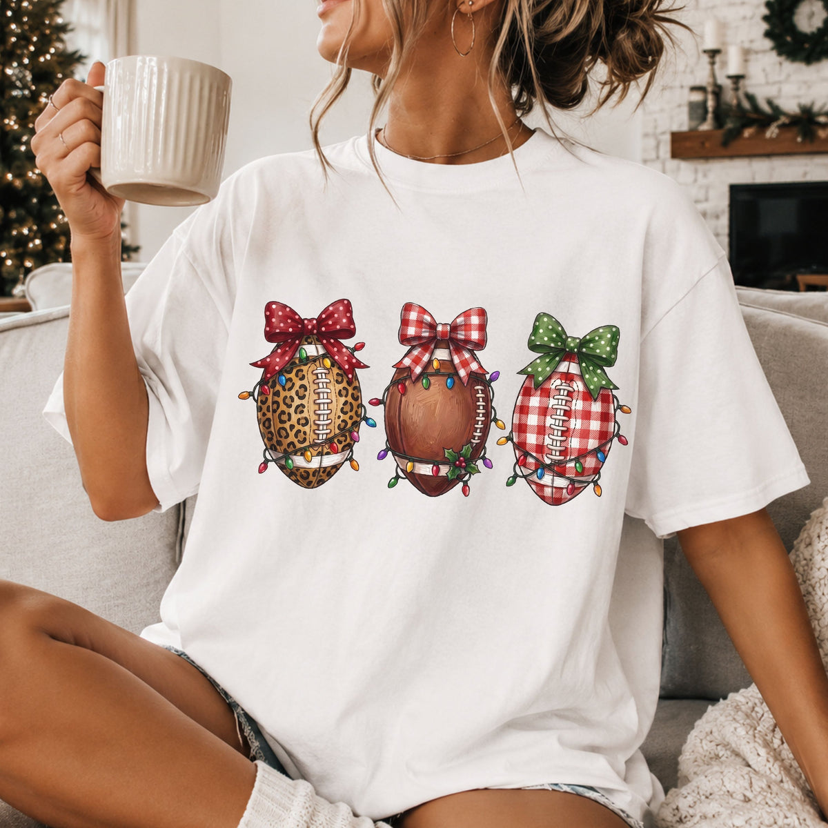Three footballs in leopard print, brown and red gingham, wrapped in colorful Christmas lights and topped with red polka dot, red gingham and green polka dot bows.