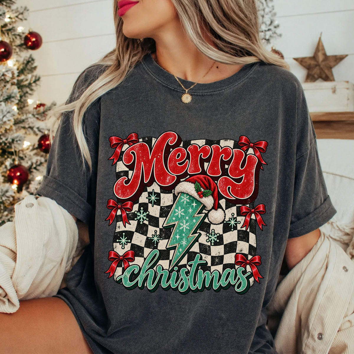 “Merry Christmas” in red and teal lettering with a teal lightning bolt wearing a Santa hat, red bows and snowflakes over a distressed black and cream checkerboard.