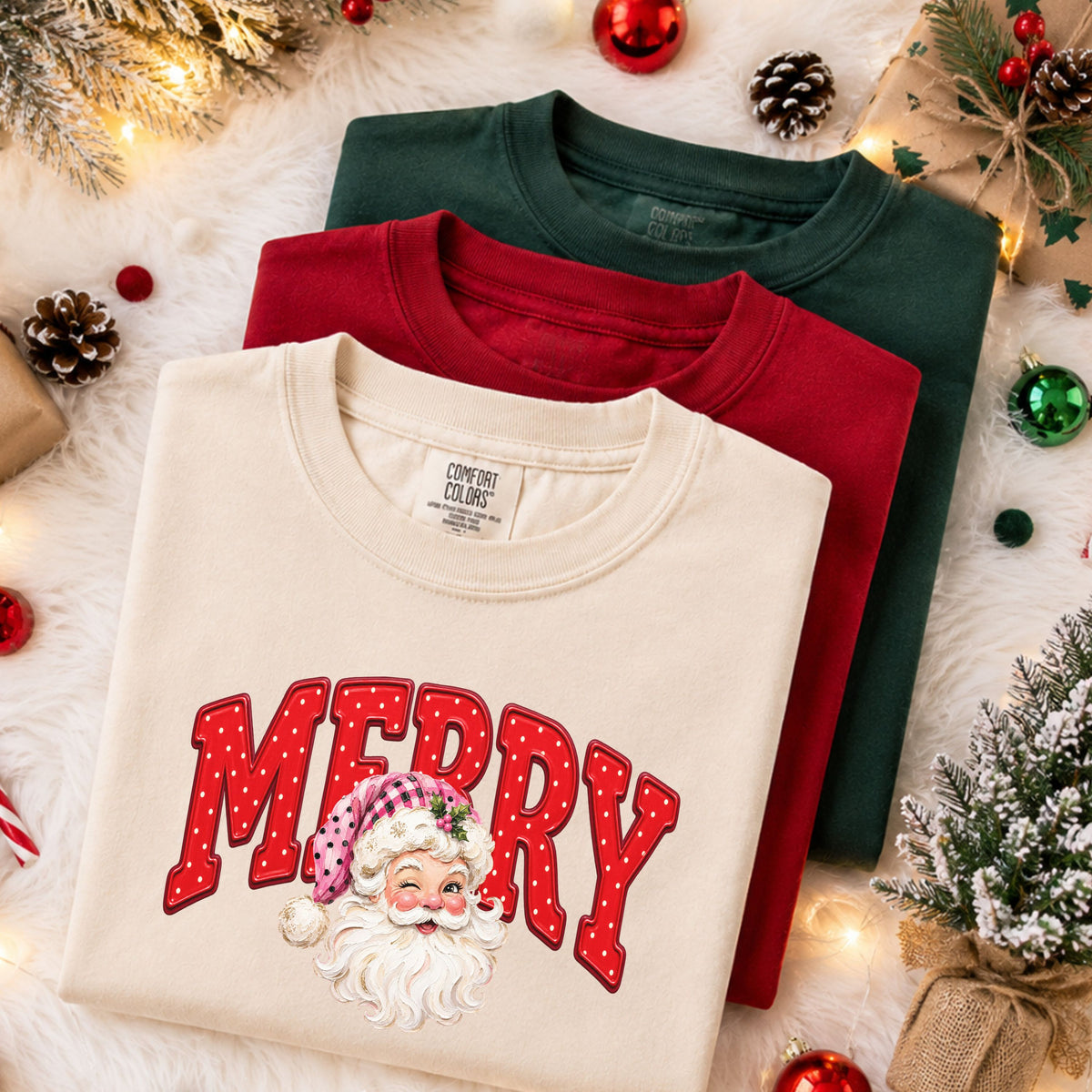 “Merry” in arched red varsity letters with cream polka dots behind a winking Santa wearing a pink hat with black dots, a checkered pattern and holly.