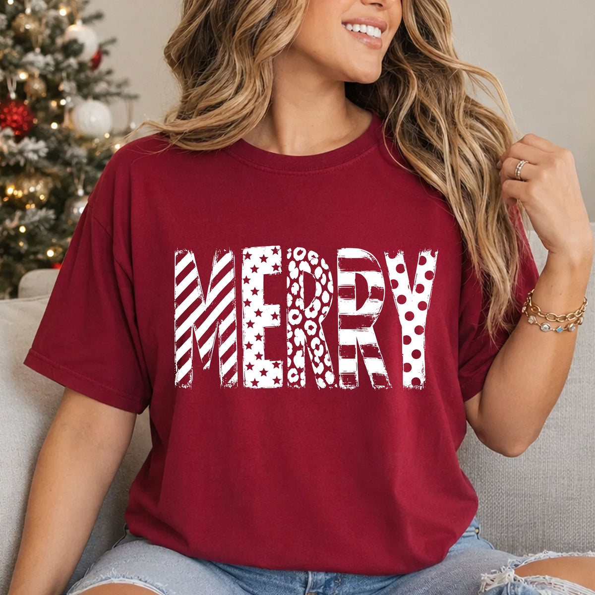 MERRY in tall, distressed white block letters featuring diagonal and horizontal stripes, stars, leopard print and polka dots.