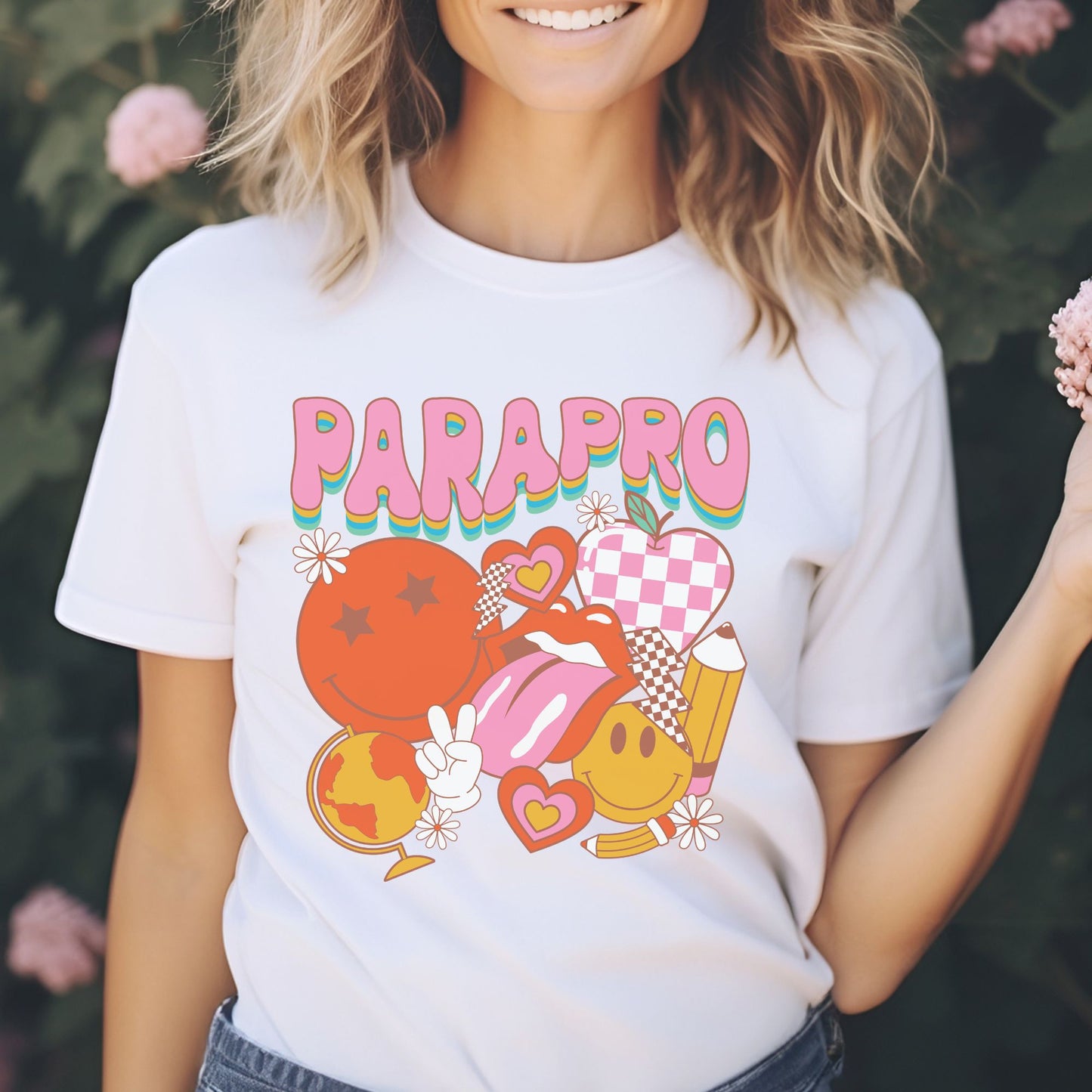 Retro Parapro design featuring colorful groovy lettering with a checkerboard apple, globe, pencil, smiley faces, hearts, flowers, and playful school icons.