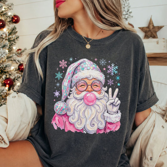 Pink disco Santa Christmas DTF transfer with a mirrored disco ball hat, round glasses, pink bubblegum, a peace sign and pastel snowflakes.