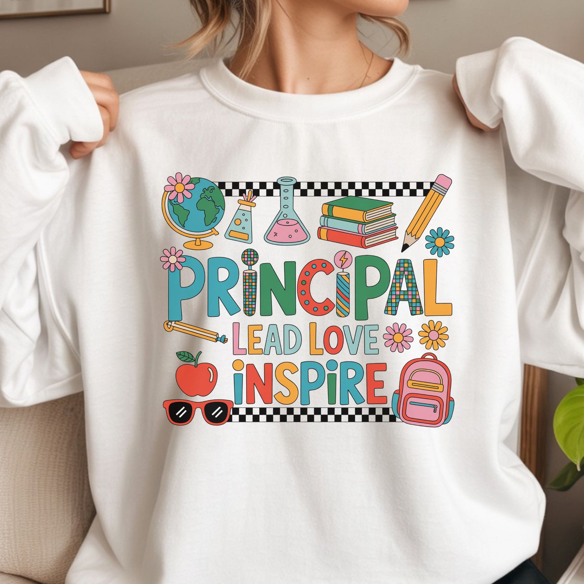 Colorful principal design featuring Lead Love Inspire lettering with a globe, science beakers, books, pencil, apple, backpack, flowers, sunglasses, and checkerboard accents.
