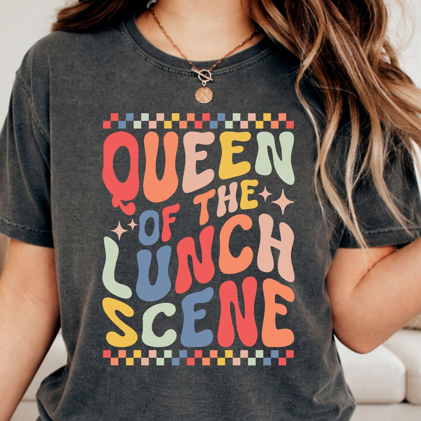 Queen of the Lunch Scene design featuring colorful retro lettering, sparkle accents, and checkerboard borders for lunch ladies, cafeteria staff, and school food service workers.