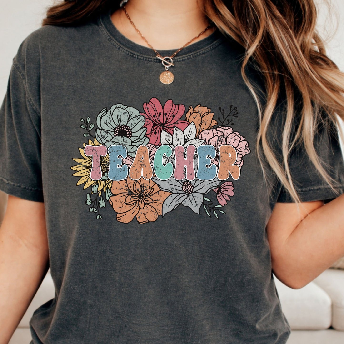 Retro floral Teacher design featuring distressed pastel lettering surrounded by a large bouquet of colorful wildflowers in pink, blue, orange, yellow, and sage green.
