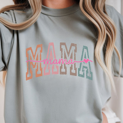 Retro Mama typography featuring distressed multicolor varsity block letters with pink script lettering and heart accent. Perfect for moms, Mother's Day, and everyday boutique apparel.
