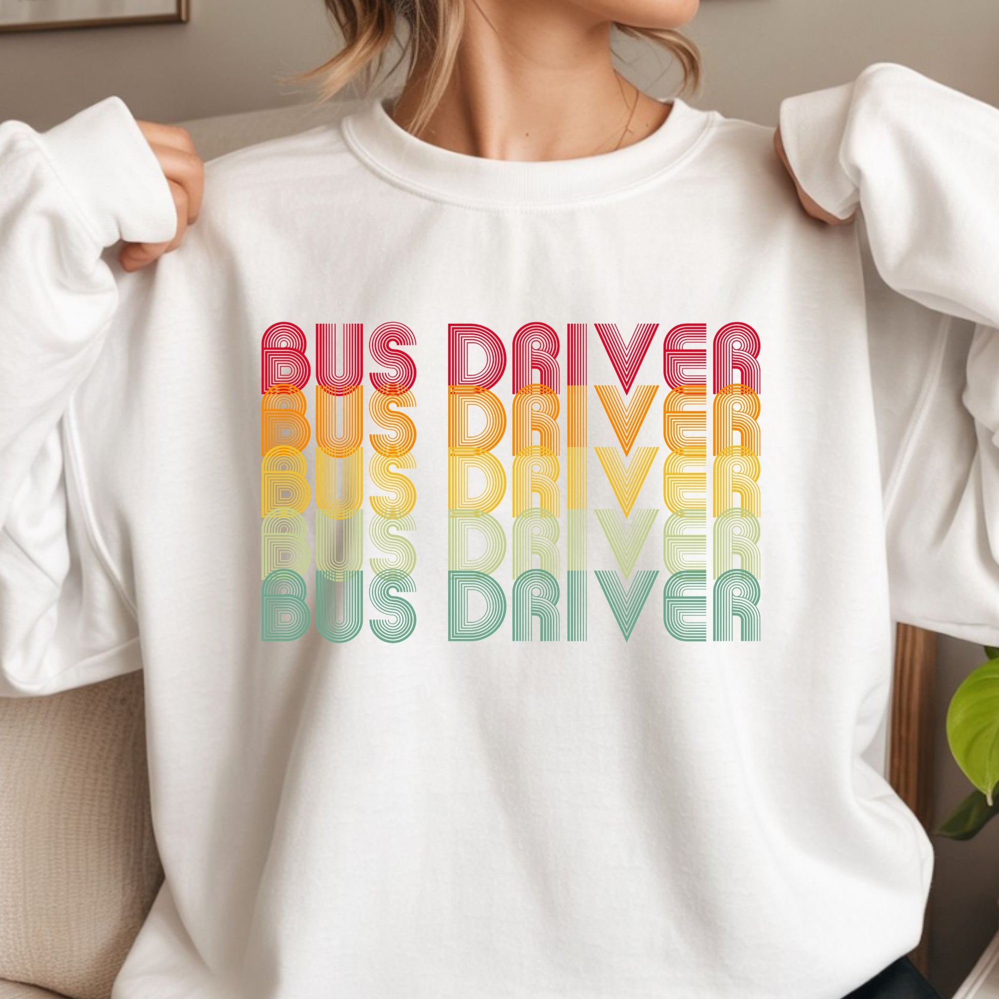 Retro Bus Driver design featuring repeated rainbow-gradient lettering in red, orange, yellow, green, and blue with a bold vintage line-art style.