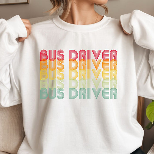 Retro Bus Driver design featuring repeated rainbow-gradient lettering in red, orange, yellow, green, and blue with a bold vintage line-art style.