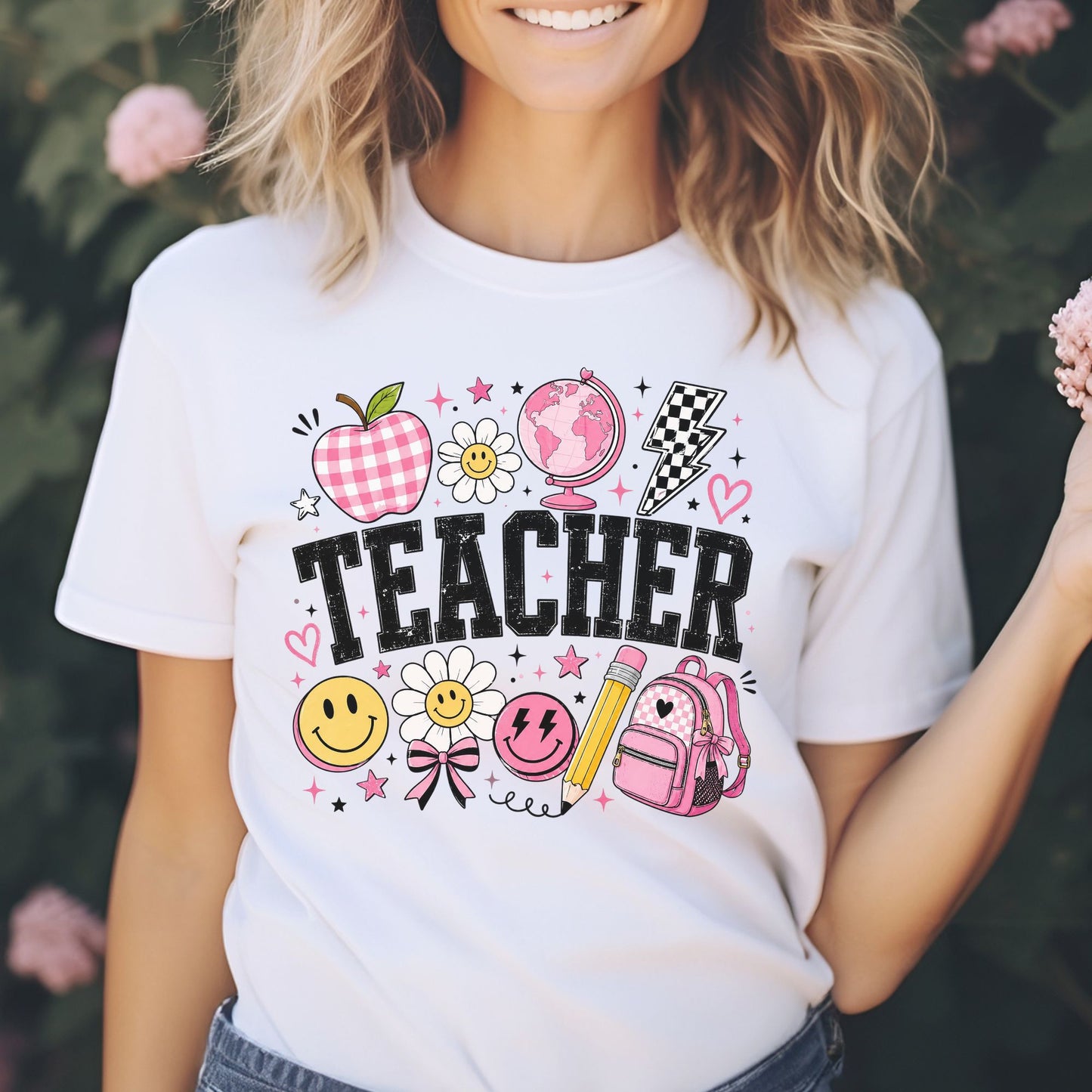 Retro Teacher design featuring distressed black lettering with a pink gingham apple, globe, checkerboard lightning bolt, smiley faces, daisies, pencil, backpack, bows, hearts, and playful school icons.