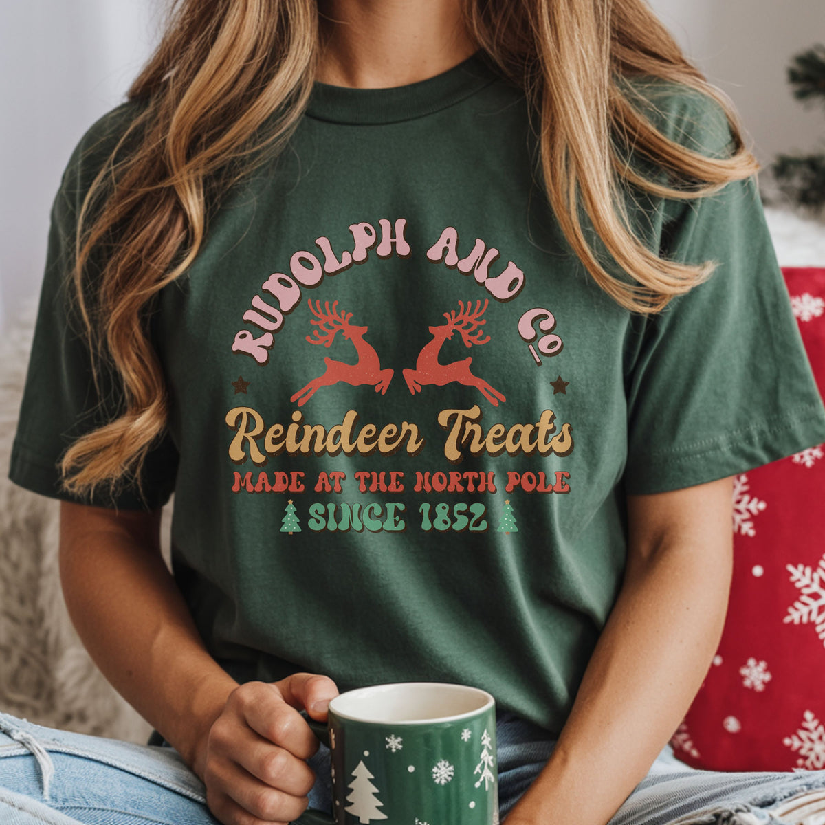 “Rudolph and Co. Reindeer Treats,” “Made at the North Pole” and “Since 1852” with two red reindeer, mint Christmas trees and distressed retro lettering.