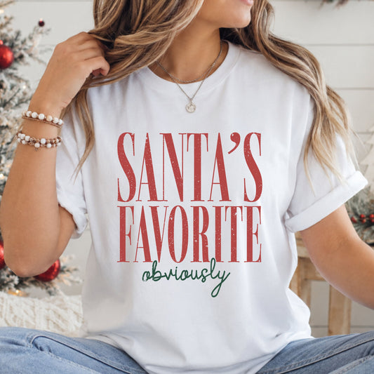 “Santa's Favorite” in tall red serif lettering with “obviously” in dark green script underneath, creating a vintage Christmas typography design.