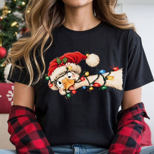 Goofy cream goose with its tongue out, wearing a red Santa hat with holly and tangled in red, blue, green and yellow Christmas lights around its head and neck.