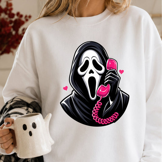 Horror Halloween DTF transfer featuring a black hooded slasher mask character holding a bright pink retro telephone with pink hearts and bold spooky details.