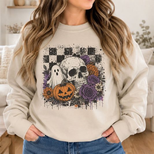 Spooky Halloween DTF transfer featuring a large skull, sheet ghost, jack-o-lantern pumpkin, purple and orange flowers, black checkerboard and grunge details