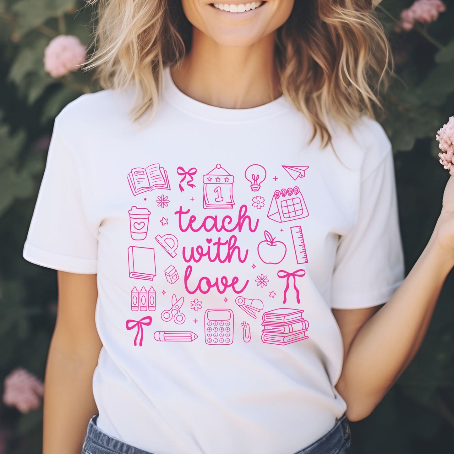 Teach With Love DTF transfer featuring bright pink script lettering surrounded by school doodles, books, bows, apple, ruler, crayons, calculator, and classroom supplies.
