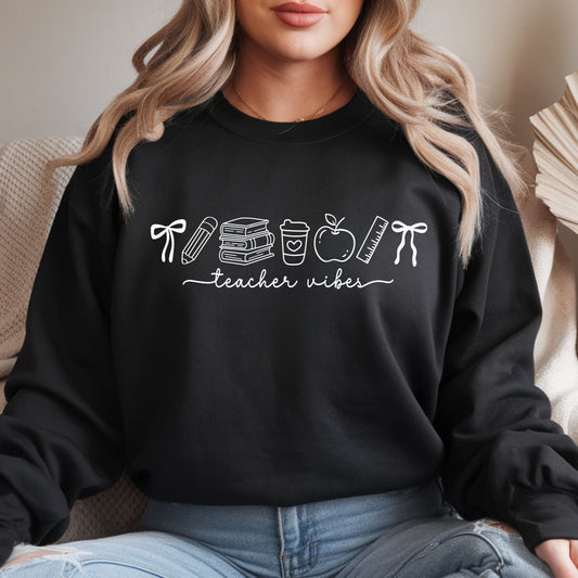Teacher Vibes design featuring clean white line-art school doodles including bows, a pencil, stacked books, a coffee cup, apple, and ruler arranged above handwritten teacher lettering.