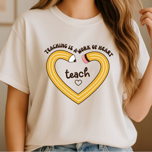 Teaching Is a Work of Heart teacher design featuring a large yellow pencil shaped into a heart, brown retro lettering, pink eraser, and a simple classroom-inspired layout.