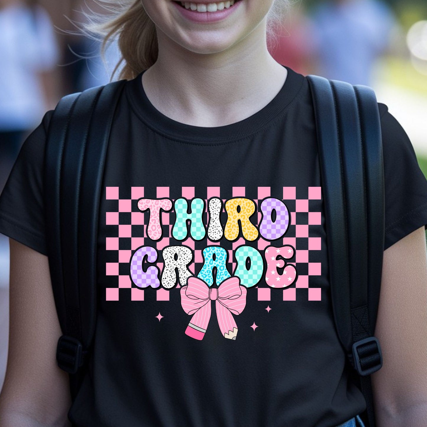 Third Grade back-to-school design featuring colorful patterned bubble letters, a pink checkerboard background, pencil bow, sparkles, leopard print, and playful classroom style.