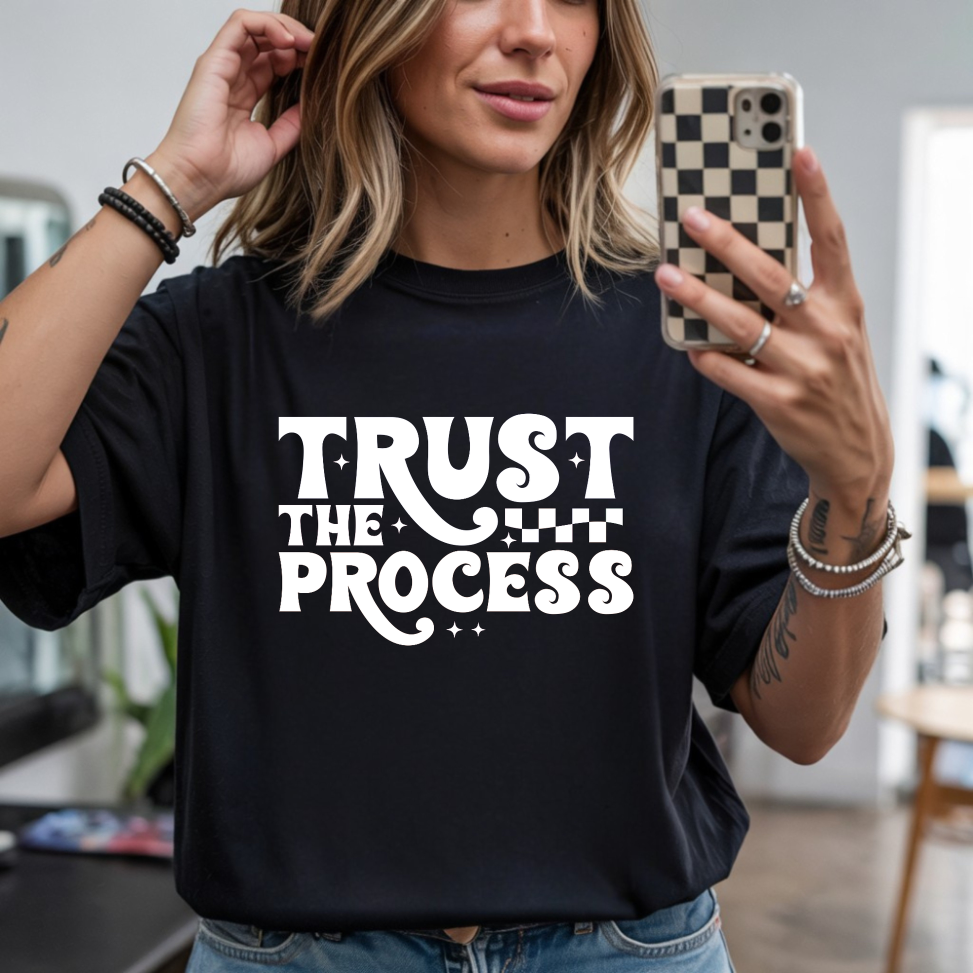 Trust the Process motivational DTF transfer design pressed on a black graphic t-shirt mockup