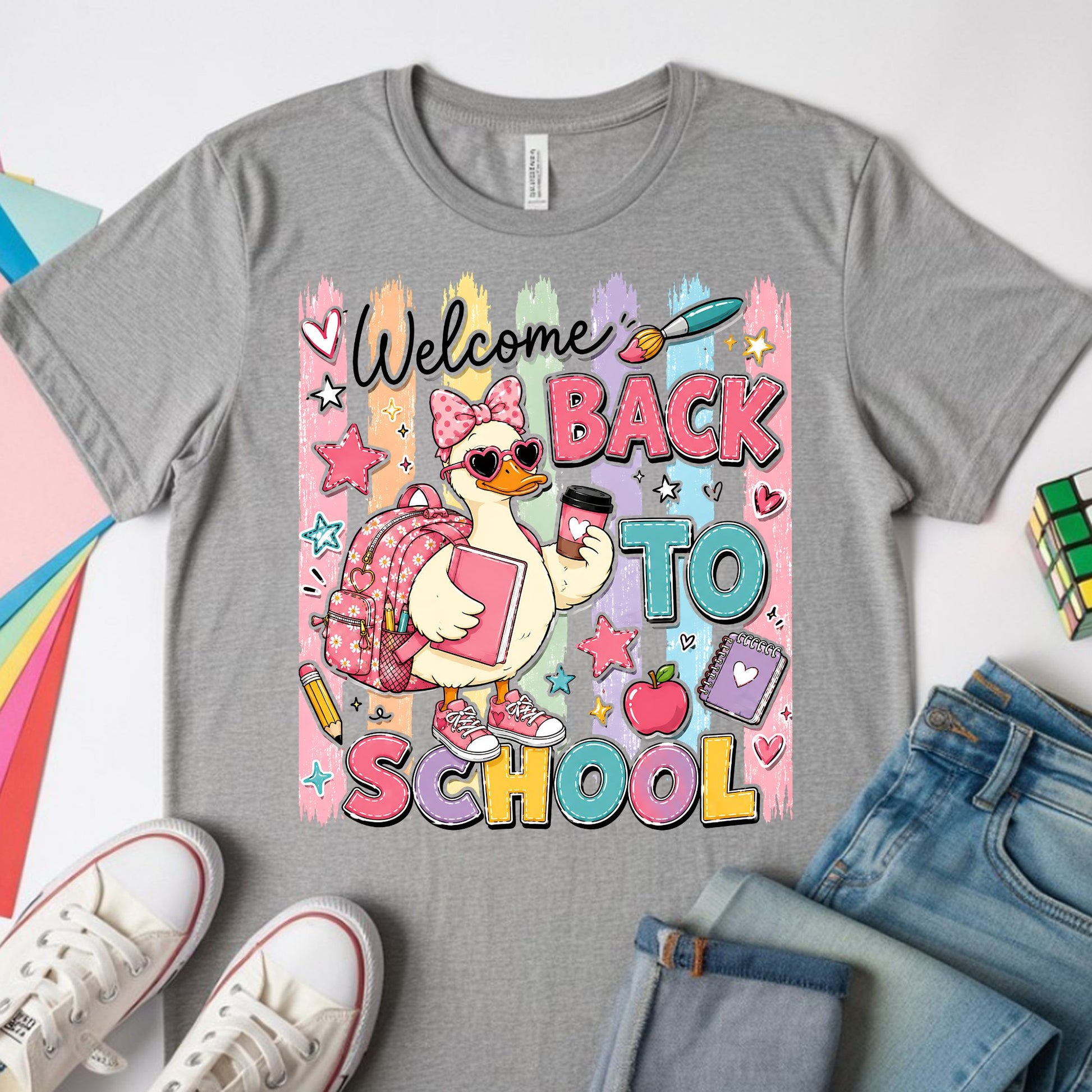 Cute welcome back to school goose wearing a pink bow, heart sunglasses, backpack, sneakers, and holding school supplies with colorful pastel classroom graphics.