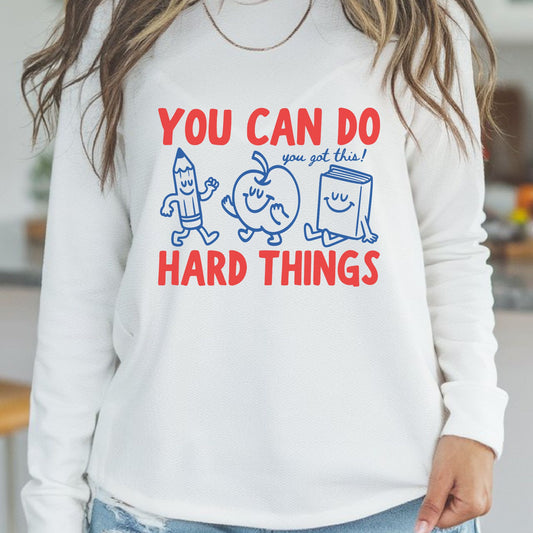 You Can Do Hard Things motivational DTF transfer featuring red and blue lettering with smiling pencil, apple, and book characters for teacher and school shirts.
