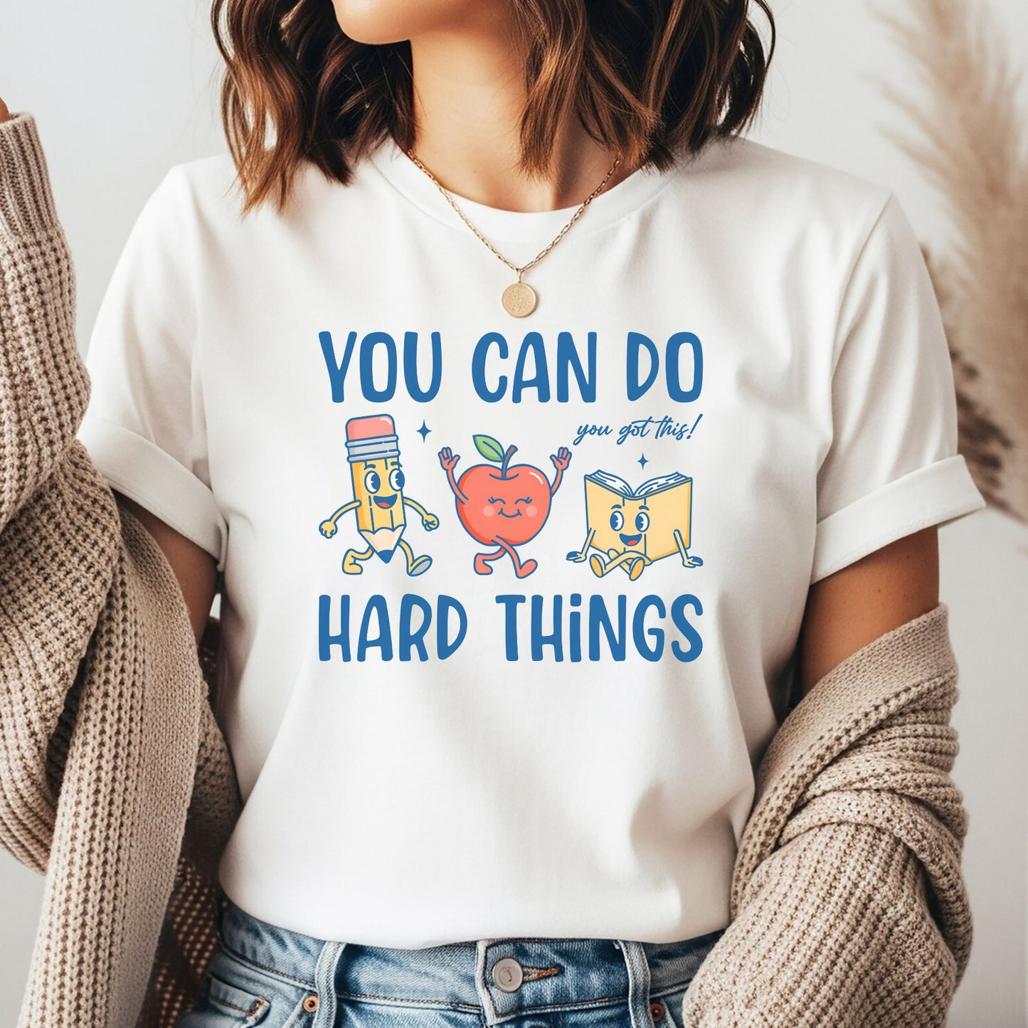 You Can Do Hard Things DTF transfer featuring cheerful retro pencil, apple, and book characters with blue lettering for teacher and school shirts.